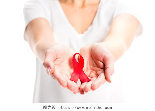 世界艾滋病日概念的手拿红色丝带